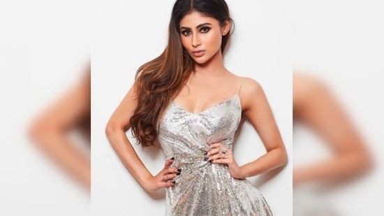 Mouni Roy shines bright like a diamond in this short stunning silver metallic dress.(Instagram/@imouniroy)