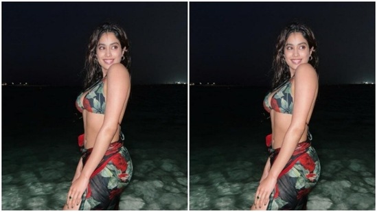 Janhvi posed in a black bikini with red floral motifs.(Instagram/@janhvikapoor)