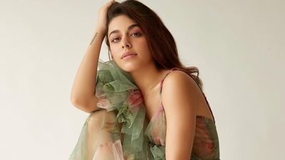Made of sheer tulle fabric, the see-through gown featured white and orange floral patterns all over and a frill flower on the waist. (Instagram/chandiniw) Made of sheer tulle fabric, the see-through gown featured white and orange floral patterns all over and a frill flower on the waist. (Instagram/chandiniw)
