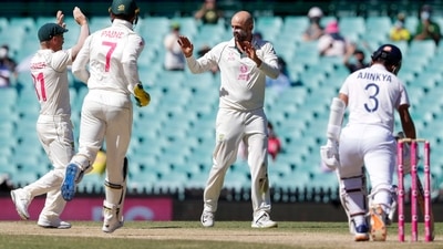 Australia's Nathan Lyon, second right, is congratulated by teammates after dismissing India's Ajinkya Rahane, right, during play on the final day of the third cricket test between India and Australia at the Sydney Cricket Ground, Sydney, Australia, Monday, Jan. 11, 2021. (AP)