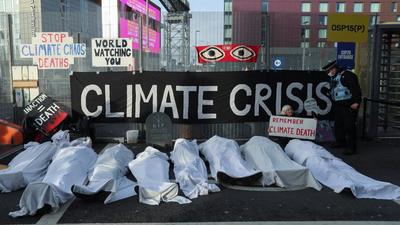 People protest outside the UN Climate Change Conference (COP26) venue in Glasgow, Scotland in the United Kingdom earlier this week. (REUTERS PHOTO.) People protest outside the UN Climate Change Conference (COP26) venue in Glasgow, Scotland in the United Kingdom earlier this week. (REUTERS PHOTO.)