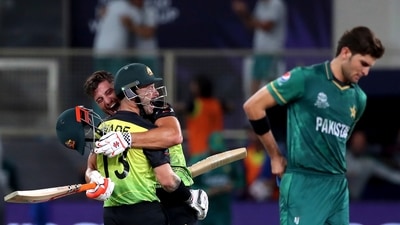 Pakistan's Shaheen Afridi, right, reacts as Australia's Matthew Wade, left, and Marcus Stoinis celebrate their win in the Cricket Twenty20 World Cup semi-final match between Pakistan and Australia in Dubai, UAE, Thursday, Nov. 11, 2021. (AP) Pakistan's Shaheen Afridi, right, reacts as Australia's Matthew Wade, left, and Marcus Stoinis celebrate their win in the Cricket Twenty20 World Cup semi-final match between Pakistan and Australia in Dubai, UAE, Thursday, Nov. 11, 2021. (AP)