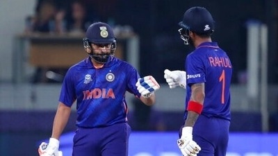 India's KL Rahul, right, celebrates with batting partner Rohit Sharma after hitting a boundary plays a shot during the Cricket Twenty20 World Cup match between India and Scotland in Dubai, UAE, Friday, Nov. 5, 2021. (AP)