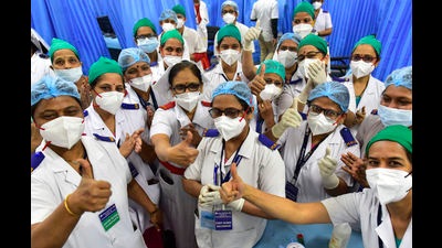 BMC medical staff at KEM Hospital, Mumbai celebrate after giving the first vaccination shot on January 16, 2021, the first day of the national vaccination programme. (HT FILE) BMC medical staff at KEM Hospital, Mumbai celebrate after giving the first vaccination shot on January 16, 2021, the first day of the national vaccination programme. (HT FILE)