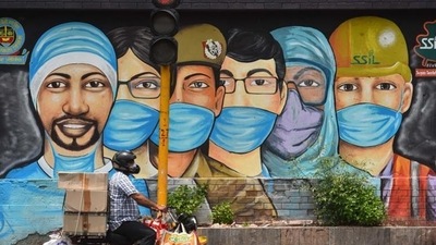 A motorist passes by a mural of frontline workers against coronavirus at RK Puram in New Delhi. (Sanchit Khanna/HT file photo) A motorist passes by a mural of frontline workers against coronavirus at RK Puram in New Delhi. (Sanchit Khanna/HT file photo)