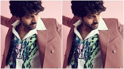 Kartik looked dapper in a white shirt with quirky prints in shades of blue and black. (Instagram/@kartikaaryan) Kartik looked dapper in a white shirt with quirky prints in shades of blue and black. (Instagram/@kartikaaryan)