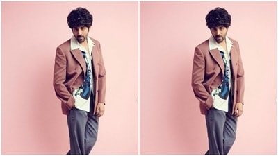 Kartik teamed his look with a coral formal blazer and a pair of grey trousers. (Instagram/@kartikaaryan) Kartik teamed his look with a coral formal blazer and a pair of grey trousers. (Instagram/@kartikaaryan)