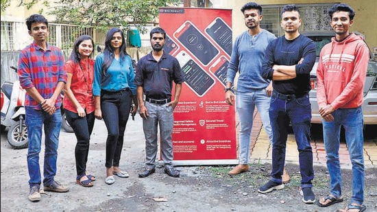 Sanchek Pilane (second from right), founder, Exa Mobility with his team outside their offices in Bibwewadi. (Rahul Raut/HT PHOTO)