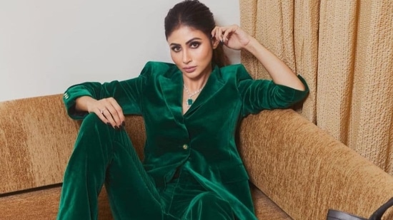 Want to serve a bombshell look as you head to work this winter or take a business trip? Let Bollywood actor Mouni Roy sort your fashion cues as she turned cover girl for a magazine and put her sartorial foot forward in a green velvet pantsuit.(Instagram/imouniroy)