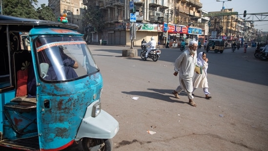 Pedestrians cross a street in Karachi, Pakistan, on Friday, (File Photo / Bloomberg) Pedestrians cross a street in Karachi, Pakistan, on Friday, (File Photo / Bloomberg)