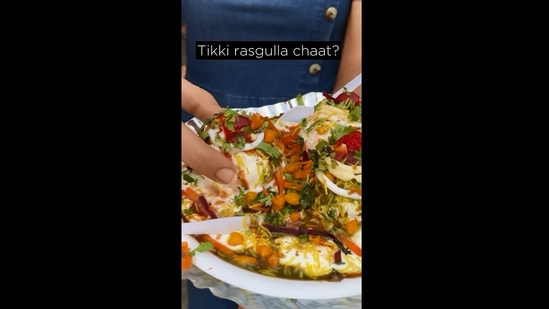 The image shows the food blogger trying ‘Tikki rasgulla chaat’. (Instagram/@sooosaute)