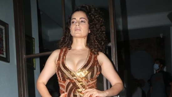 Kangana Ranaut chose a gown with a thigh-high slit for the party. She was celebrating the shoot wrap of her film Tejas in which she plays an Air Force pilot. (Varinder Chawla)