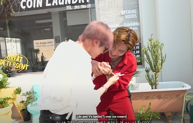 BTS members Jin and V fight over ice cream.