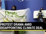 A protestor tried to disrupt the press conference of COP26 president after adoption of Glasgow climate agreement (AFP)
