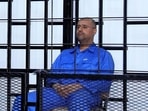 Saif al-Islam Gaddafi, son of late Libyan leader Muammar Gaddafi, attends a hearing behind bars in a courtroom in Zintan.(Reuters/File) Saif al-Islam Gaddafi, son of late Libyan leader Muammar Gaddafi, attends a hearing behind bars in a courtroom in Zintan.(Reuters/File)