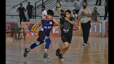Players during a match on the concluding day of the Punjab Open 3X3 Basketball Tournament at Guru Nanak Stadium in Ludhiana on Sunday. (Harsimar Pal Singh/HT)