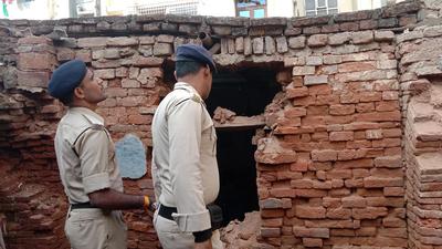 Police inspect the blast site near Janakdhari School at Sultanganj Lal Kothi in Danapur, Patna on Sunday. (Santosh Kumar/HT Photo)