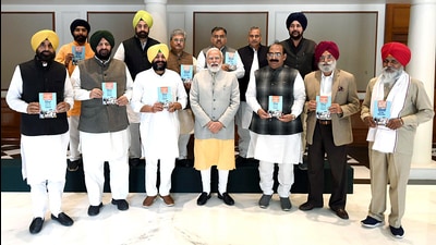 A delegation of BJP leaders from Punjab met PM Narendra Modi and submitted a memorandum, urging him to reopen Kartarpur Corridor. (ANI)