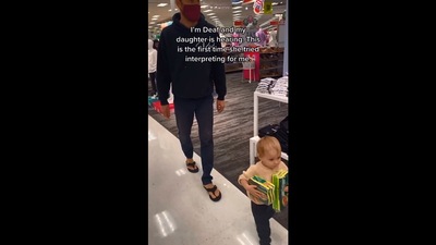 The image shows the daughter shopping with her dad. (Instagram/@oursignedworld)