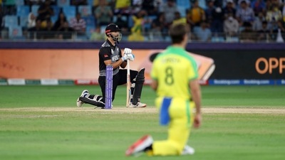 New Zealand's Daryl Mitchell and Australia's Mitchell Marsh, 8, take a knee before the Cricket Twenty20 World Cup final match between Australia and New Zealand in Dubai, UAE, Sunday, Nov. 14, 2021. (AP Photo/Kamran Jebreili) (AP) New Zealand's Daryl Mitchell and Australia's Mitchell Marsh, 8, take a knee before the Cricket Twenty20 World Cup final match between Australia and New Zealand in Dubai, UAE, Sunday, Nov. 14, 2021. (AP Photo/Kamran Jebreili) (AP)