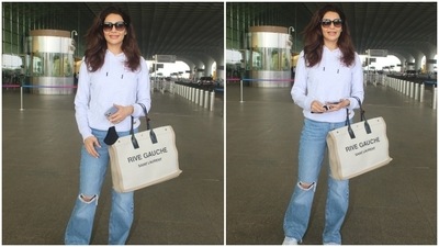 Karishma wore the ensemble with chunky white lace-up sneakers, a black face mask, sunglasses, and a classy watch. She also carried a Yves Saint Laurent Rive Gauche Tote Bag in an off-white and beige shade. (HT Photo/Varinder Chawla) Karishma wore the ensemble with chunky white lace-up sneakers, a black face mask, sunglasses, and a classy watch. She also carried a Yves Saint Laurent Rive Gauche Tote Bag in an off-white and beige shade. (HT Photo/Varinder Chawla)