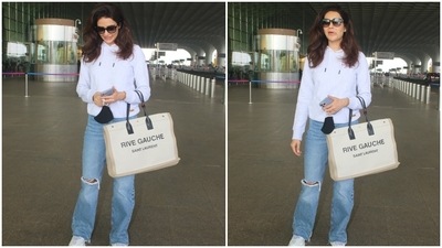 Karishma teamed it with high waist denim pants. She chose wide-leg jeans that carried distressed details on the thighs and knees. (HT Photo/Varinder Chawla) Karishma teamed it with high waist denim pants. She chose wide-leg jeans that carried distressed details on the thighs and knees. (HT Photo/Varinder Chawla)