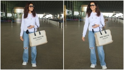 The paparazzo clicked Karishma in a simple grey sweatshirt, perfect for the fall season. The hooded top with drawstrings on the neckline featured gathered cuffs and hem. (HT Photo/Varinder Chawla) The paparazzo clicked Karishma in a simple grey sweatshirt, perfect for the fall season. The hooded top with drawstrings on the neckline featured gathered cuffs and hem. (HT Photo/Varinder Chawla)