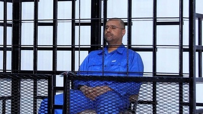 Saif al-Islam Gaddafi, son of late Libyan leader Muammar Gaddafi, attends a hearing behind bars in a courtroom in Zintan. (Reuters/File)