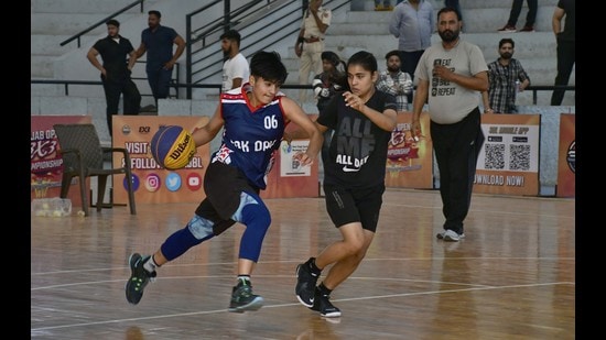 Players during a match on the concluding day of the Punjab Open 3X3 Basketball Tournament at Guru Nanak Stadium in Ludhiana on Sunday. (Harsimar Pal Singh/HT)