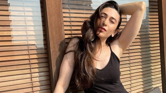 As athleisure wear continues to be a rage, Bollywood actor Karisma Kapoor left fashionistas impressed on Sunday as she served a spicy hot look in all black athleisure style.(Instagram/therealkarismakapoor)