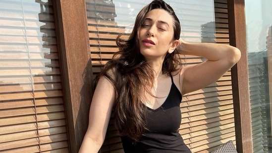 Taking to her social media handle, the diva shared a slew of sunkissed pictures that featured her donning a black spaghetti top that came with a plunging V-neckline to add to the oomph factor.(Instagram/therealkarismakapoor)
