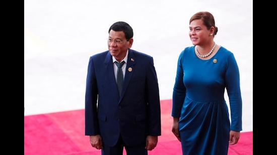 Sara Duterte and Philippines president Rodrigo Duterte (AFP)