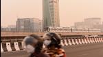 Commuters ride a two wheeler on NH48 in heavy smog and pollution in Gurugram on Monday. (Vipin Kumar/HT PHOTO) Commuters ride a two wheeler on NH48 in heavy smog and pollution in Gurugram on Monday. (Vipin Kumar/HT PHOTO)