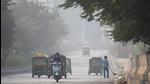 Commuters make their way along a street amid smoggy conditions in New Delhi on Monday. (AFP) Commuters make their way along a street amid smoggy conditions in New Delhi on Monday. (AFP)