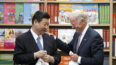 Chinese Vice-President Xi Jinping and US Vice-President Joe Biden hold T-shirts students gave them at the International Studies Learning Center in South Gate, California, on February 17, 2012. China and US gear up for first Xi Jinping-Joe Biden virtual summit as Taiwan looms. (AP) Chinese Vice-President Xi Jinping and US Vice-President Joe Biden hold T-shirts students gave them at the International Studies Learning Center in South Gate, California, on February 17, 2012. China and US gear up for first Xi Jinping-Joe Biden virtual summit as Taiwan looms. (AP)