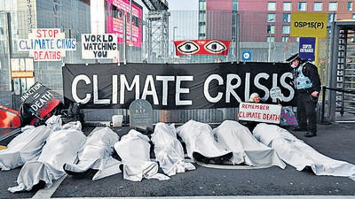 People protest against the climate crisis outside the venue of COP26 in Glasgow on November 11. (Reuters)