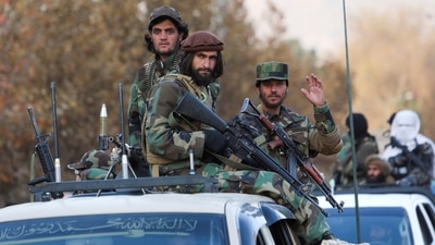 Members of Taliban sit on a military vehicle during Taliban military parade in Kabul, Afghanistan. (REUTERS)
