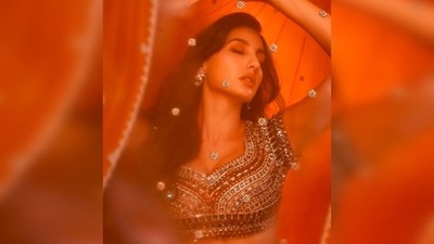 Nora Fatehi struck a sensuous pose in a gorgeous red lehenga and made heads turn. (Instagram/@norafatehi) Nora Fatehi struck a sensuous pose in a gorgeous red lehenga and made heads turn. (Instagram/@norafatehi)