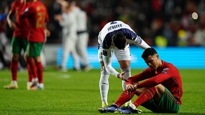Cristiano Ronaldo is comforted by a Serbian player after Portugal's loss.&nbsp; (Getty)