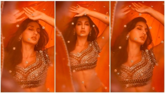Nora Fatehi has lately been getting a lot of love and praise for her Indian looks. The actor/dancer recently took to her Instagram handle to share a few stills of herself looking like a dream in an embellished red lehenga set.(Instagram/@norafatehi)