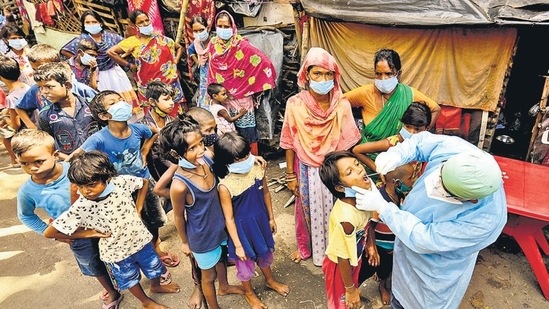 A healthcare worker collects swab samples of underprivileged children for Covid-19 test in Kolkata. SC on Monday sought to know the status of relief granted to children orphaned due to Covid-19 under the PM CARES for Children Scheme. (ANI file photo)