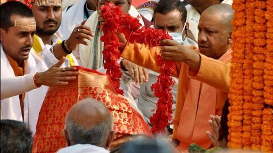 Uttar Pradesh chief minister Yogi Adityanath garlands the idol of Goddess Annapurna during its reinstallation on the Kashi Vishwanath temple premises in Varanasi on Monday. (ANI)