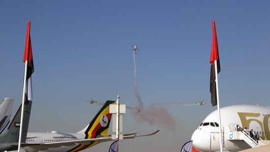 Indian Air Force (IAF) Sarang helicopters demonstrate an air show in the biennial Dubai Air Show which commenced on November 14.(ANI)