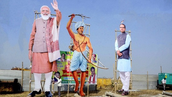 Cutouts of PM Modi, tribal leader Birsa Munda and Madhya Pradesh chief minister Shivraj Singh Chouhan are seen at Jambori Maidan in Bhopal.&nbsp;(PTI Photo)