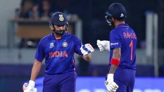 India's KL Rahul, right, celebrates with batting partner Rohit Sharma (AP)