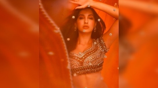 Nora Fatehi opted for jewellery from Roopa Vohra's collection to complement her Indian look.(Instagram/@norafatehi)
