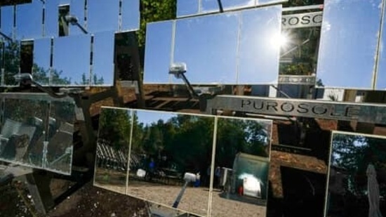 Sun is reflected in the mirrors of the Purosole, Pure Sun, solar light coffee roaster.(AP Photo/Andrew Medichini)