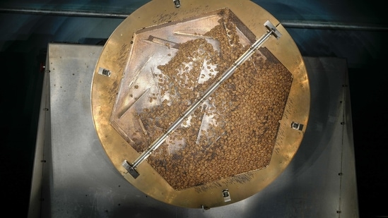 A steel basket containing fresh coffee grains rotates while toasting them in Purosole. Pure Sun, solar light coffee roaster,(AP Photo/Andrew Medichini)