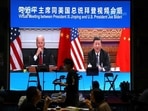 A screen shows Chinese President Xi Jinping attending a virtual meeting with US President Joe Biden via video link, at a restaurant in Beijing, China.