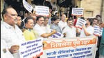 Shiv Sena party workers staged a protest at PMC headquarters against BJP on Tuesday, demanding property tax waiver for ex-servicemen. (HT)